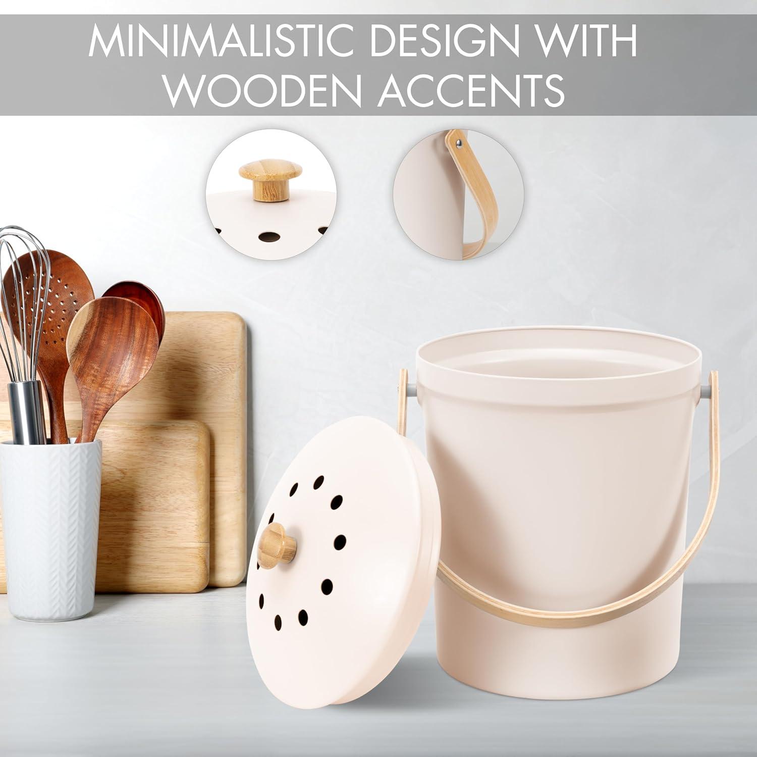 A stylish white farmhouse-style kitchen compost bin from KIBAGA with a handle.